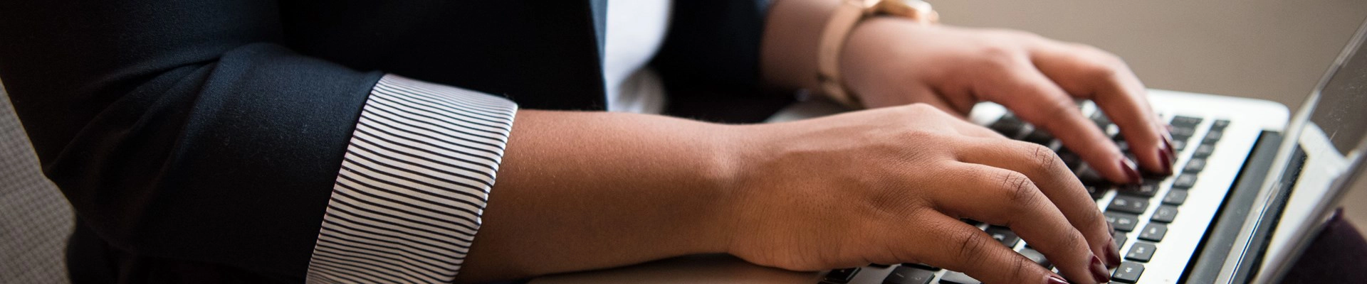 hands typing on keyboard
